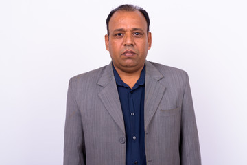 Portrait of mature overweight Indian businessman in suit