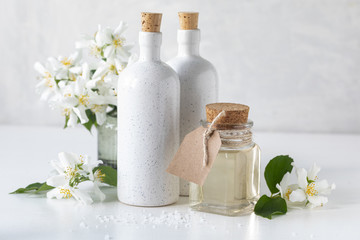 Spa concept with jasmine flowers on a white background. Copy space.
