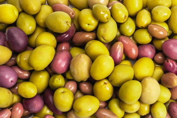 Tasty mix olives background.