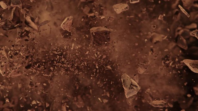 Super Slow Motion Shot of Raw Chocolate Chunks and Cocoa Powder after Being Exploded at 1000fps.