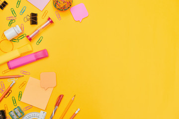 Back to school concept, school supplies on yellow background, university, college, flat lay with copy space