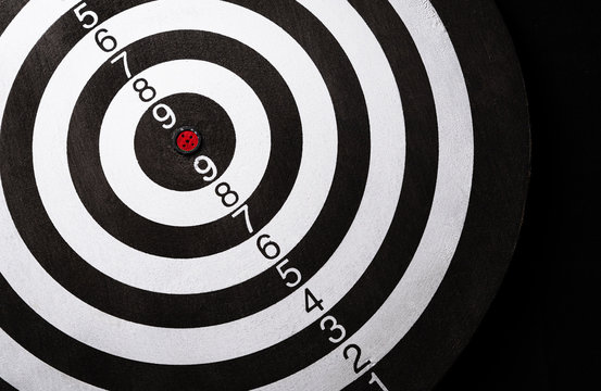 Top view of the target dartboard on dark background, business marketing, success, growth up and winner concept.