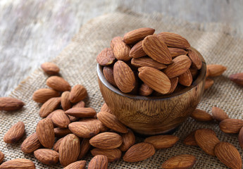 Almonds on the wood background,copy space,Close up.