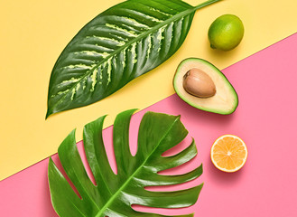 Tropical Palm Leaf and Fresh Fruits. Vegan Colorful Flat lay. Summer Design Set. Trendy Fashion concept. Creative Bright tropic citrus fruit background. Summertime color mood