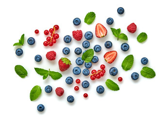 Blueberry, raspberry, blackberry, redcurrant, strawberry, cherry isolated on white. Fresh blueberry, red berries mix closeup. Raspberry, mint creative composition.