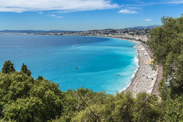 Wonderful panoramic view of Nice with colorful historical houses, seacoast and sea from Cimiez hill. Nice - luxury resort of Cote d'Azur, France.