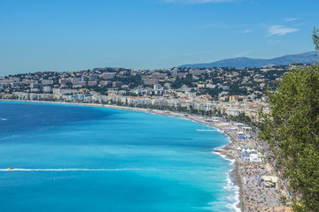 Obraz premium Wonderful panoramic view of Nice with colorful historical houses, seacoast and sea from Cimiez hill. Nice - luxury resort of Cote d'Azur, France.