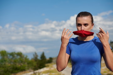 woman with protective mask  relaxing after running