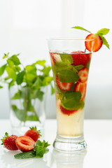 Mojito with mint and strawberries, fruit tea, strawberry mint tea.