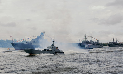 Russian warships in Volga river in Astrakhan in summer at cloudy day. Russian Military vessels.