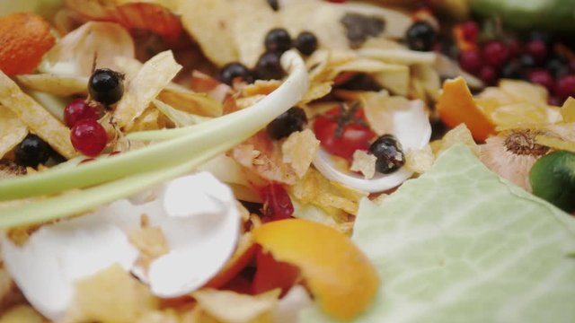 Food waste. Compostable food waste. Household waste for fruit and vegetable compost. Organic material.