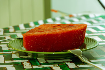 closeup of piece of watermelon on table