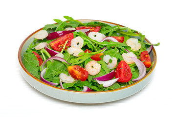 Mediterranean diet menu concept Healthy salad of fresh vegetables - tomatoes, arugula, purple onions, shrimps, soy sauce and sesame seeds in plate on white wooden table Vegan food Flat lay Top view