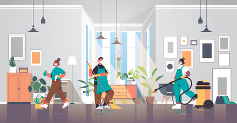 mix race cleaners in masks disinfecting coronavirus cells to prevent covid-19 pandemic cleaning service disinfection concept living room interior horizontal full length vector illustration