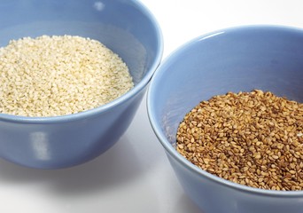 Natural Sesame and Gold Coloured Sesam, sesamum indicum, Seeds against White Background