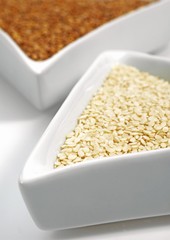 Natural Sesame and Gold Coloured Sesam, sesamum indicum, Seeds against White Background