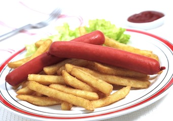 Plate with Sausage and French Fries against White Background