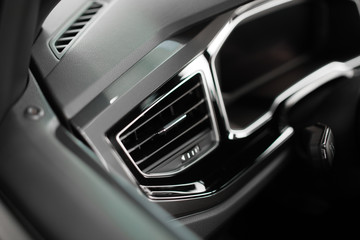 air duct in the black front panel of the car