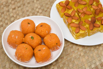 Burfi Delhi sweets for Diwali Indian mithai. Indian sweet food or diwali sweets Mithai Halwa, Milk Peda, Laddu or Ladoo, Rasgulla, Rasagulla for celebration in Delhi, India.
