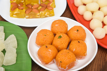 Burfi Delhi sweets for Diwali Indian mithai. Indian sweet food or diwali sweets Mithai Halwa, Milk Peda, Laddu or Ladoo, Rasgulla, Rasagulla for celebration in Delhi, India.