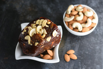 Indian sweet food Kozhikodan black Halwa made with dry fruits for celebration special occasion  Kerala India. Popular traditional festival dessert for Diwali, Ramadan, Eid, Dusshera