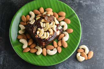 Indian sweet food Kozhikodan black Halwa made with dry fruits for celebration special occasion  Kerala India. Popular traditional festival dessert for Diwali, Ramadan, Eid, Dusshera