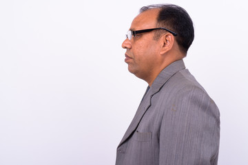 Portrait of mature overweight Indian businessman in suit