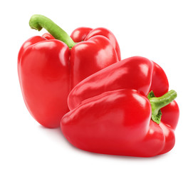 Fresh whole red bell peppers on white background