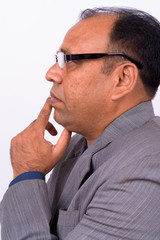Portrait of mature overweight Indian businessman in suit