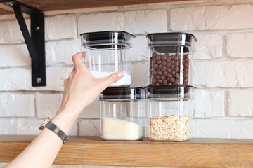 Storage cereals and sugar at home, arranging space in the kitchen