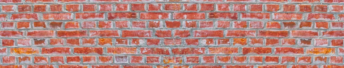 Panoramic rugged old red brown bricks wall texture. vintage retro industrial banner background.