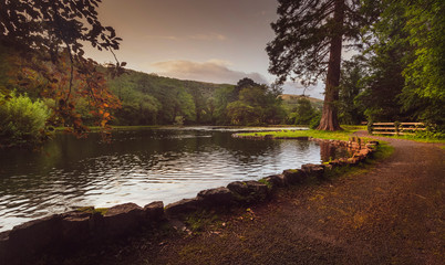 The main lake at Craig y Nos Country park in the Swansea Valley, South Wales UK, a popular place to feed the ducks.
