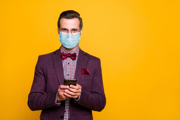 Portrait of his he nice attractive imposing guy wearing safety gauze mask using device 5g app order...