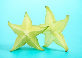 Fototapeta premium Carambola Star Fruit, averrhoa carambola, Fruit against Blue Background