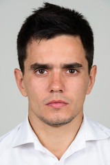 Obraz premium Portrait of handsome businessman against white background