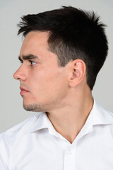 Fototapeta premium Portrait of handsome businessman against white background