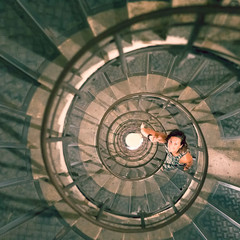 Woman in spiral staircase