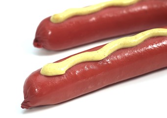 Sausage with Mustard against White Background