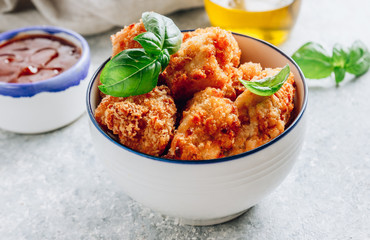 Popular Baked Cauliflower with barbeque sauce. Buffalo barbecue Cauliflower Wings. Vegan Food concept.
