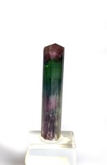 Bicolor Tourmaline Stick, Stone against White Background