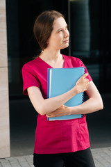 doctor woman holds folder with documents in her hands