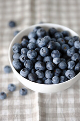 Selective focus. Macro. Blueberries in a bowl. Fresh blueberries with a bloom.