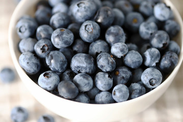 Selective focus. Macro. Blueberries in a bowl. Fresh blueberries with a bloom.