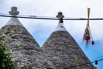 South of the Italy, alberobello with blue sky  in background and the trulli in foreground