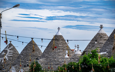 South of the Italy, alberobello with blue sky  in background and the trulli in foreground