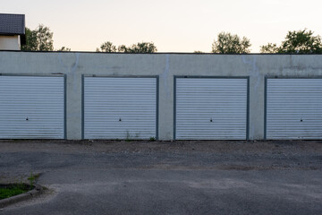 garage row at sunset with white automatic doors