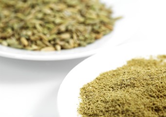 Powder and Fennel's Seed, foeniculum vulgare against White background