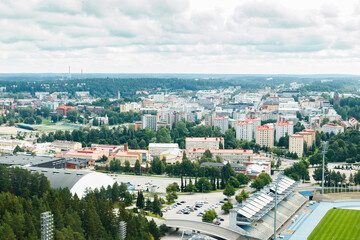 Fototapeta na wymiar Lahti, Finland - 4 August 2020: View to Lahti city and sports centre from ski jump tower Suurmaki