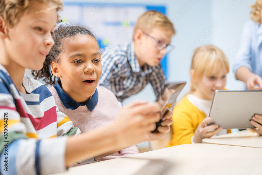 Poster elementary school computer science class: children use digital tablet computers and smartphones with