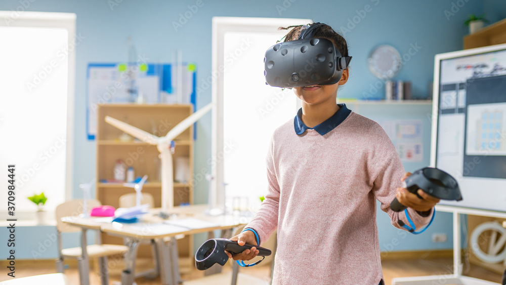 Poster elementary school computer science class: cute girl wearing augmented reality headset and using cont